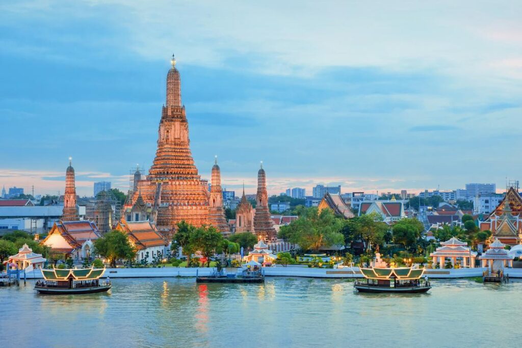 Wat Arun and cruise ship in Bangkok Thailand